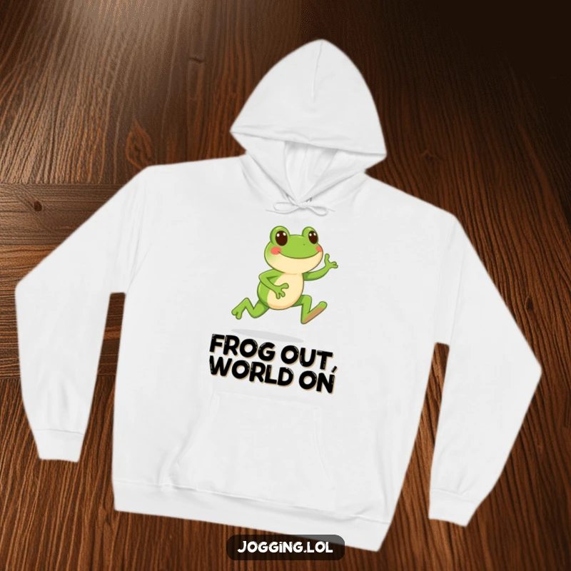 Funny hoodie featuring a happy frog character in mid-leap during a jog, designed for cozy amusement.