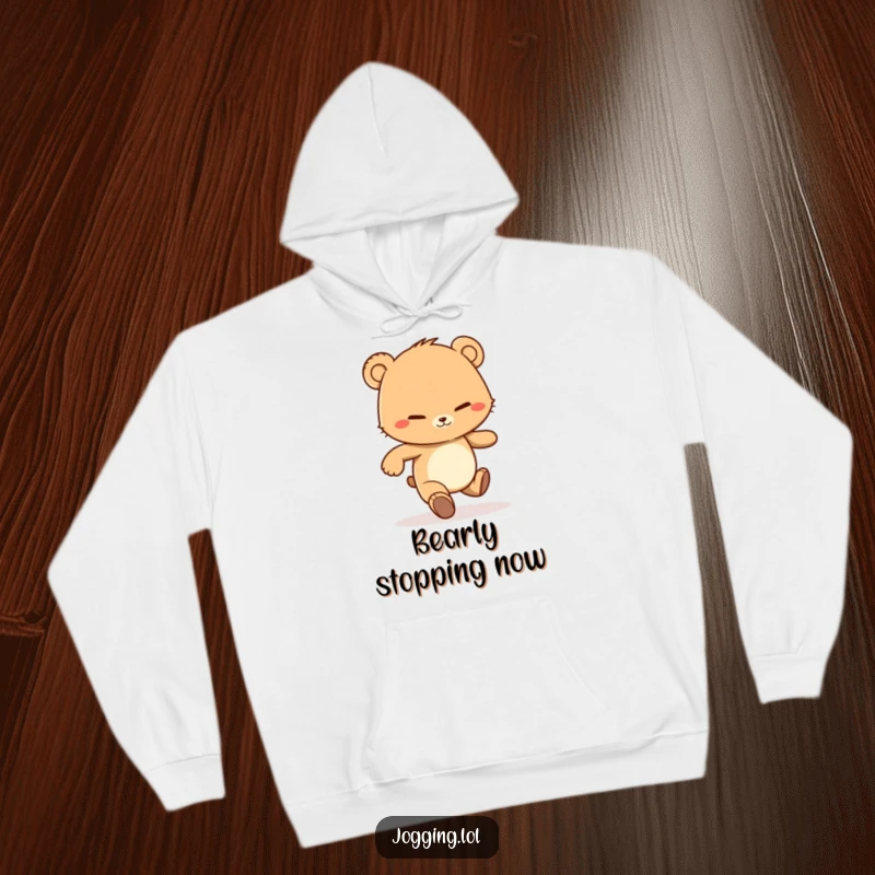 Funny hoodie featuring a determined bear cub character jogging with a grin, perfect for staying warm during workouts or relaxing.
