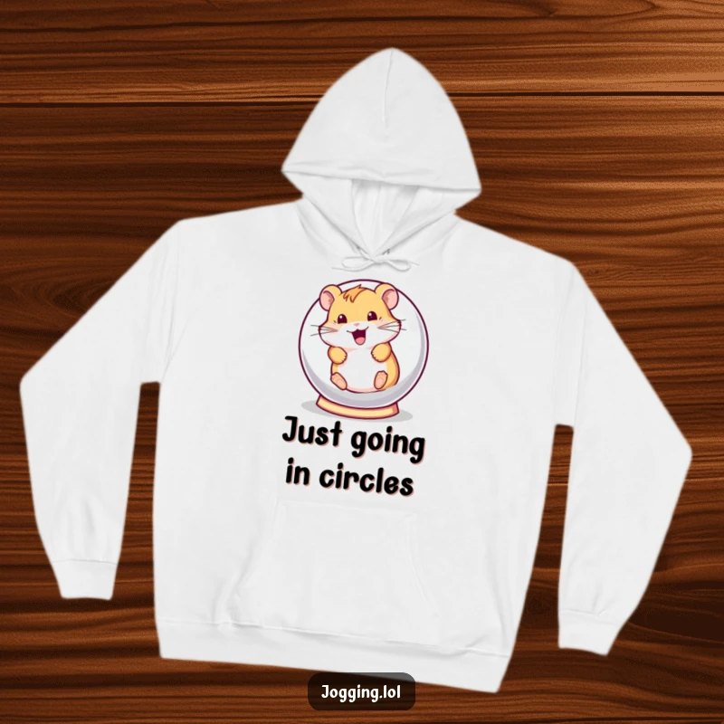 Funny hoodie with a playful hamster character excitedly rolling in a tiny hamster ball, designed for comfort and a touch of whimsy.